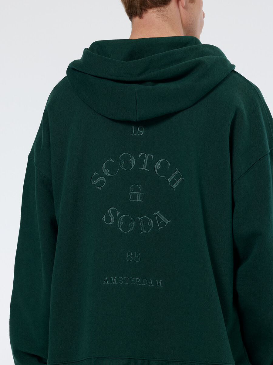 sudadera con capucha holgada con media cremallera y ribete de canalé