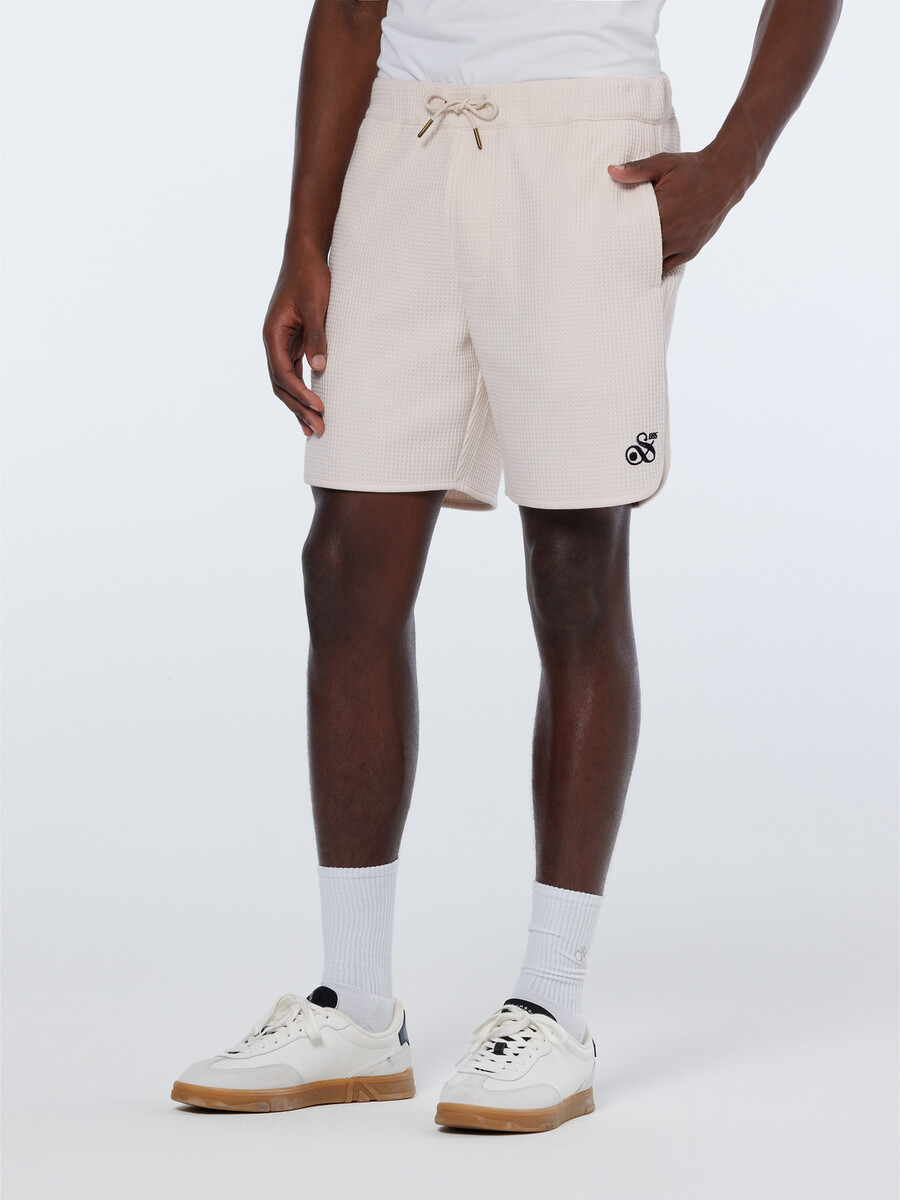 bermudas deportivas de corte relajado con diseño de gofre