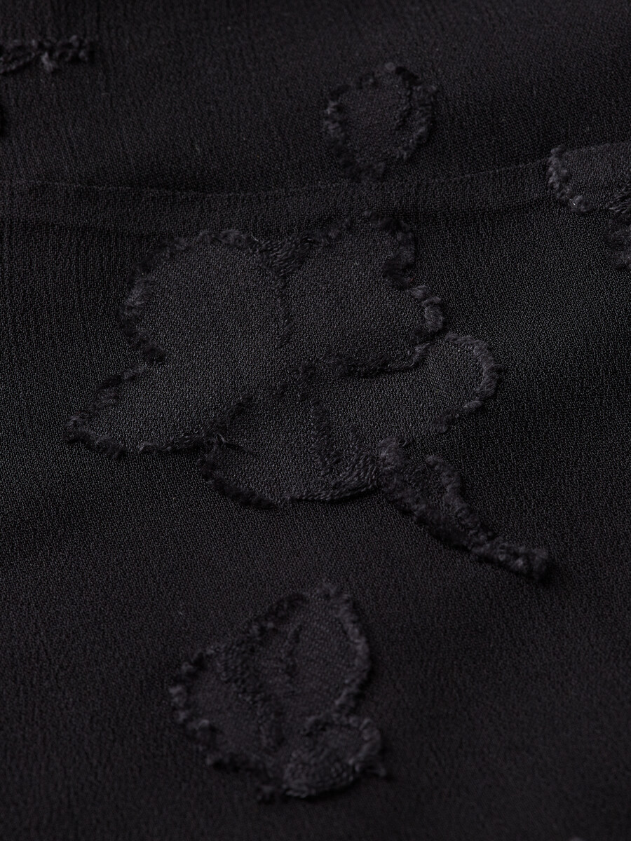 camiseta sin mangas con volantes